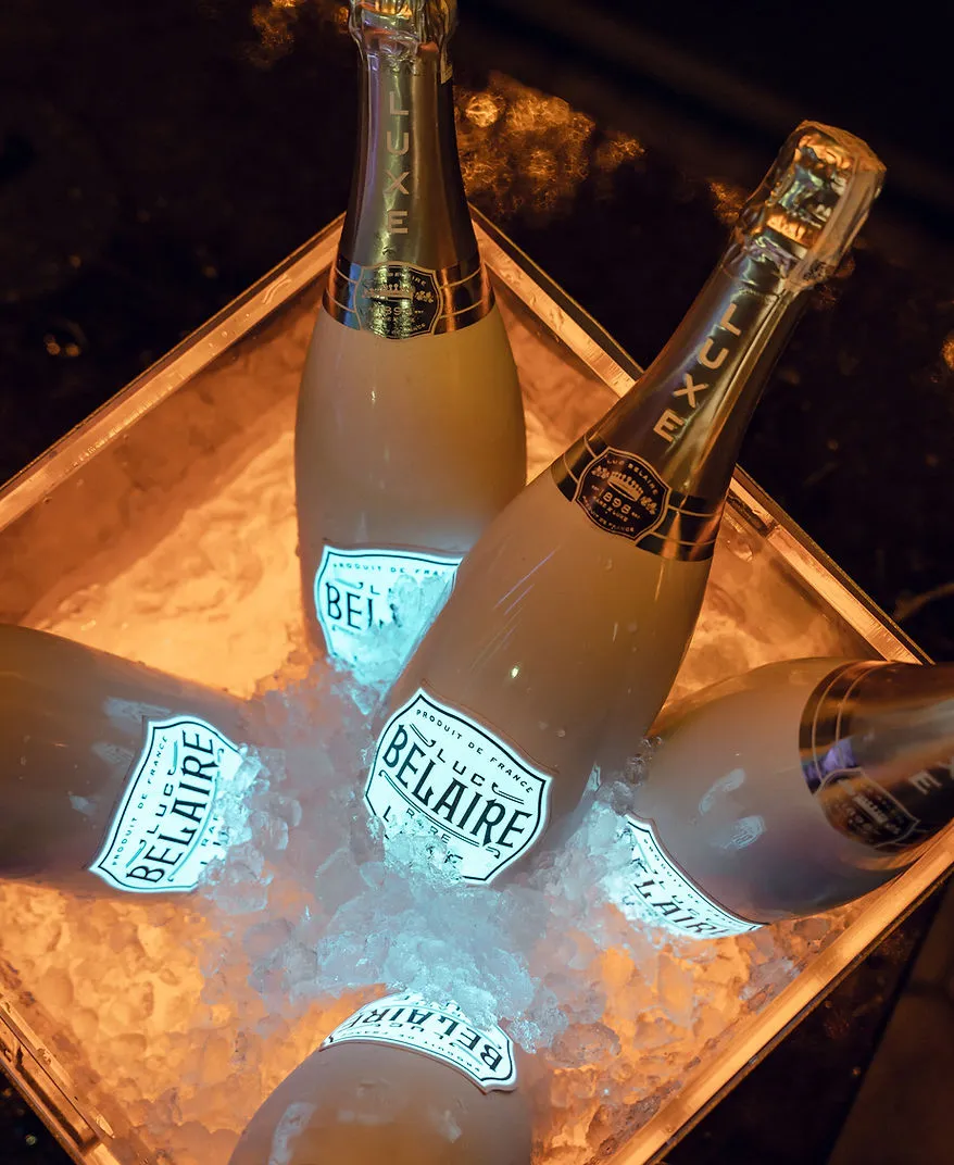 Luc Belaire Luxe champagne bottles chilling in illuminated ice bucket